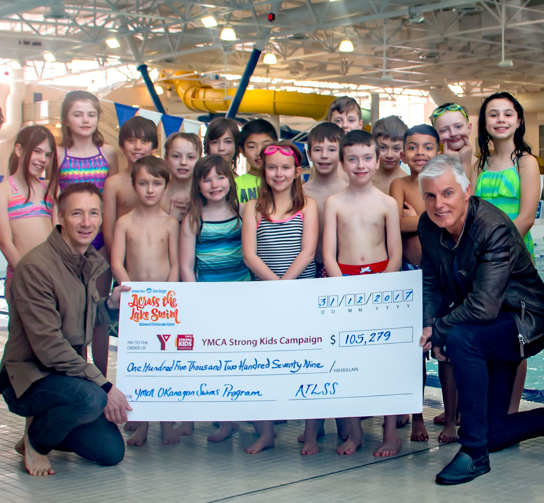 Across the Lake Swim - Cheque - 2018 (teaser) Children and donors pose with large cheque at H2O