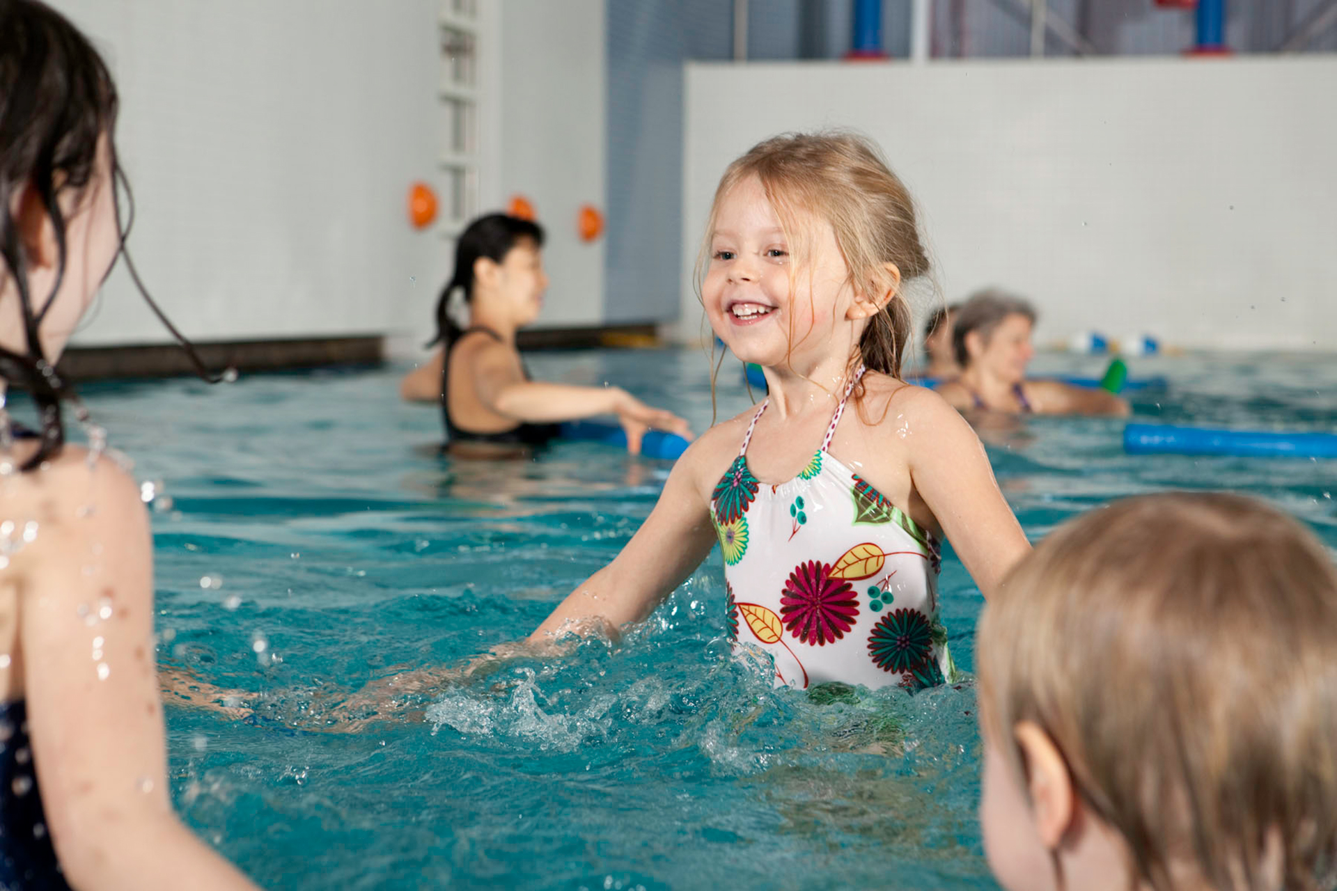 Swim lessons Young girl learning to swim