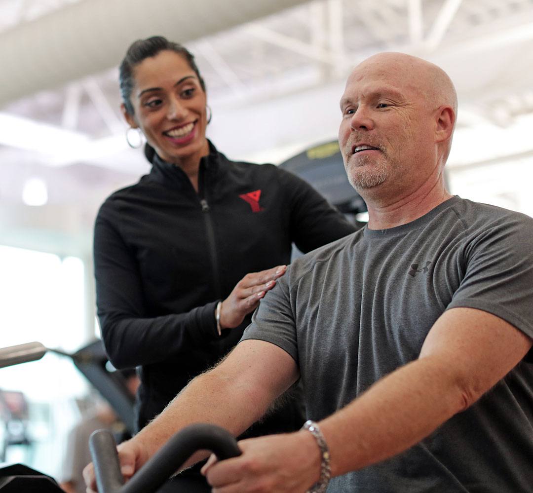 Personalized Fitness Coaching (teaser) YMCA coach encourages proper shoulder position