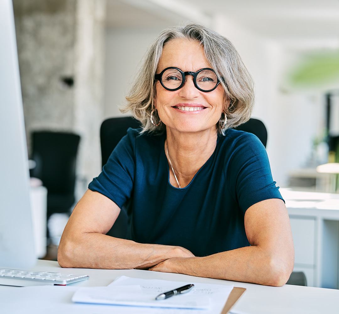 volunteer - smile woman smiling while sitting in front of computer