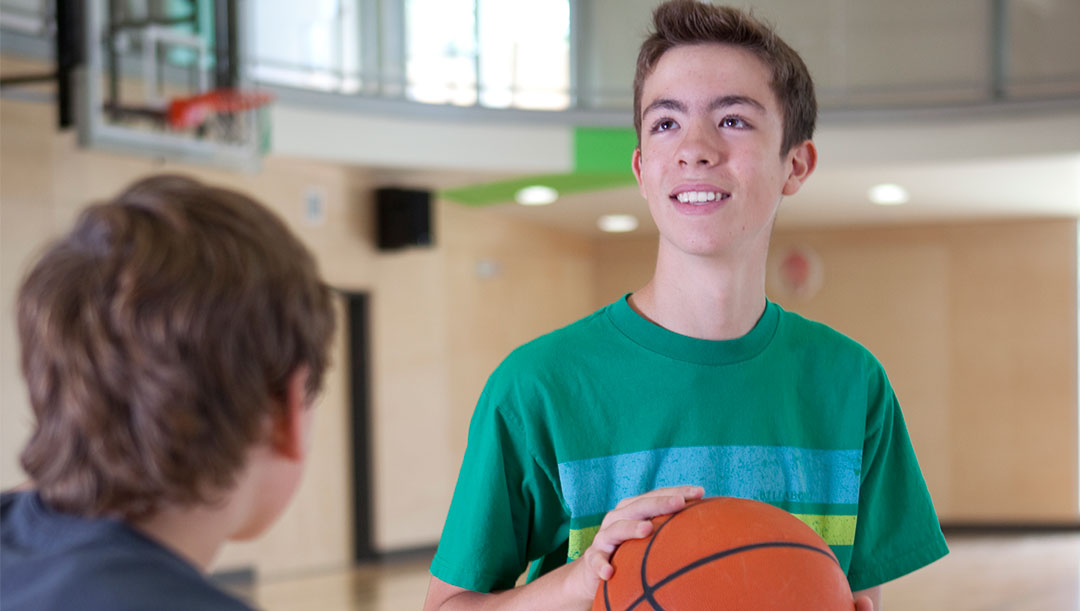 Youth Drop-in basketball (grid content) youth playing basketball in the gymnasium