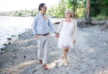 Carol and he husband walking on the beach