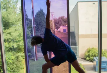 Kay doing a yoga pose