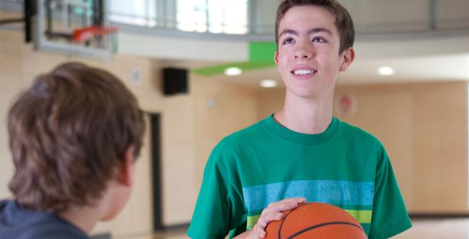 youth playing basketball in the gymnasium