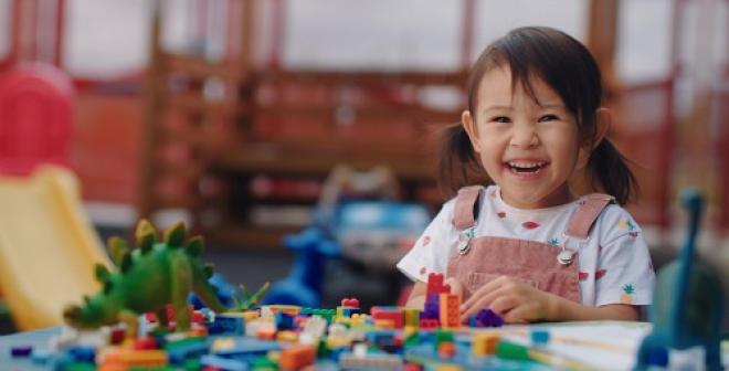 girl playing with toys