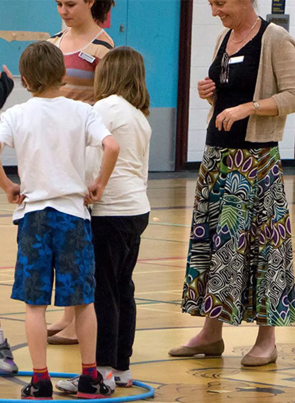 kids playing game with hula hoops and rings