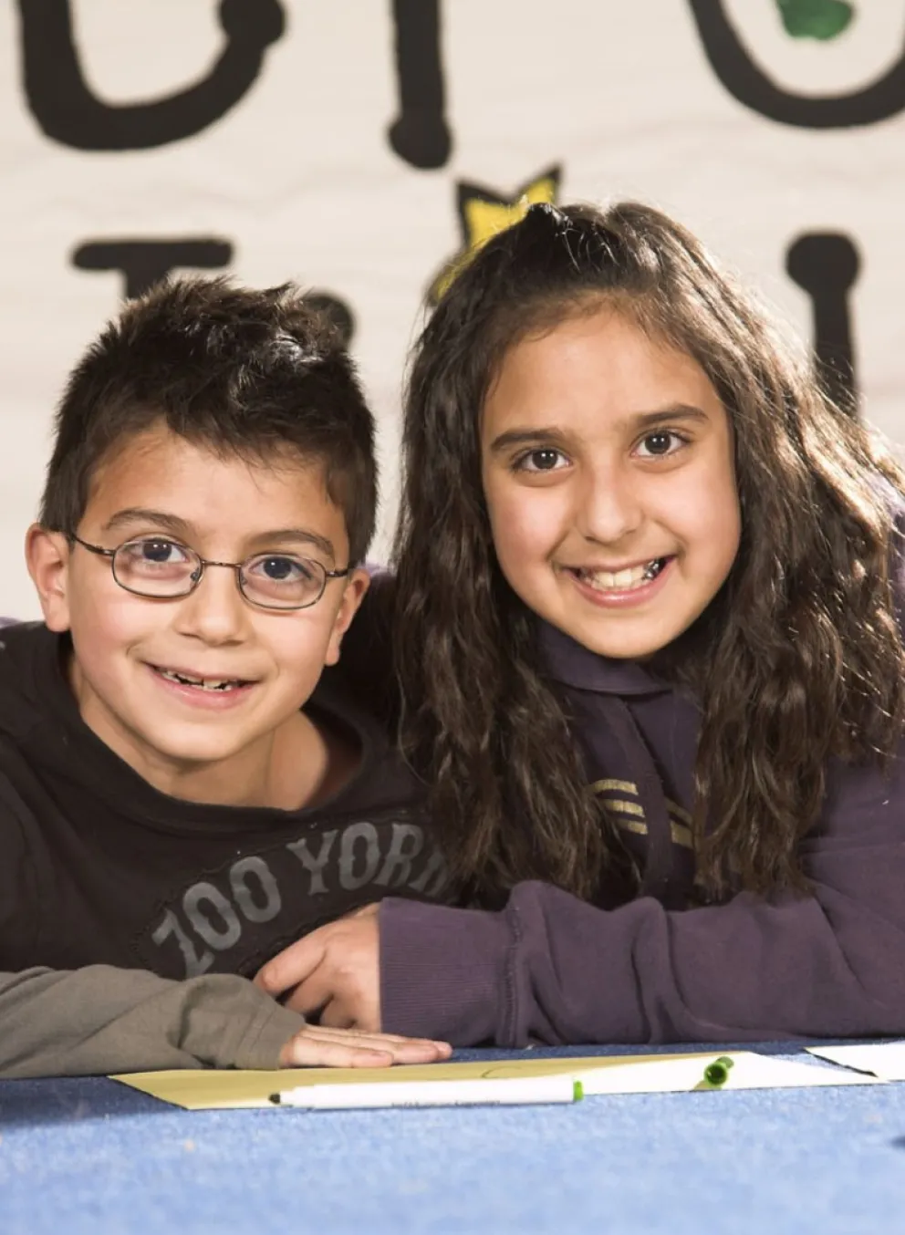 girl and boy hugging