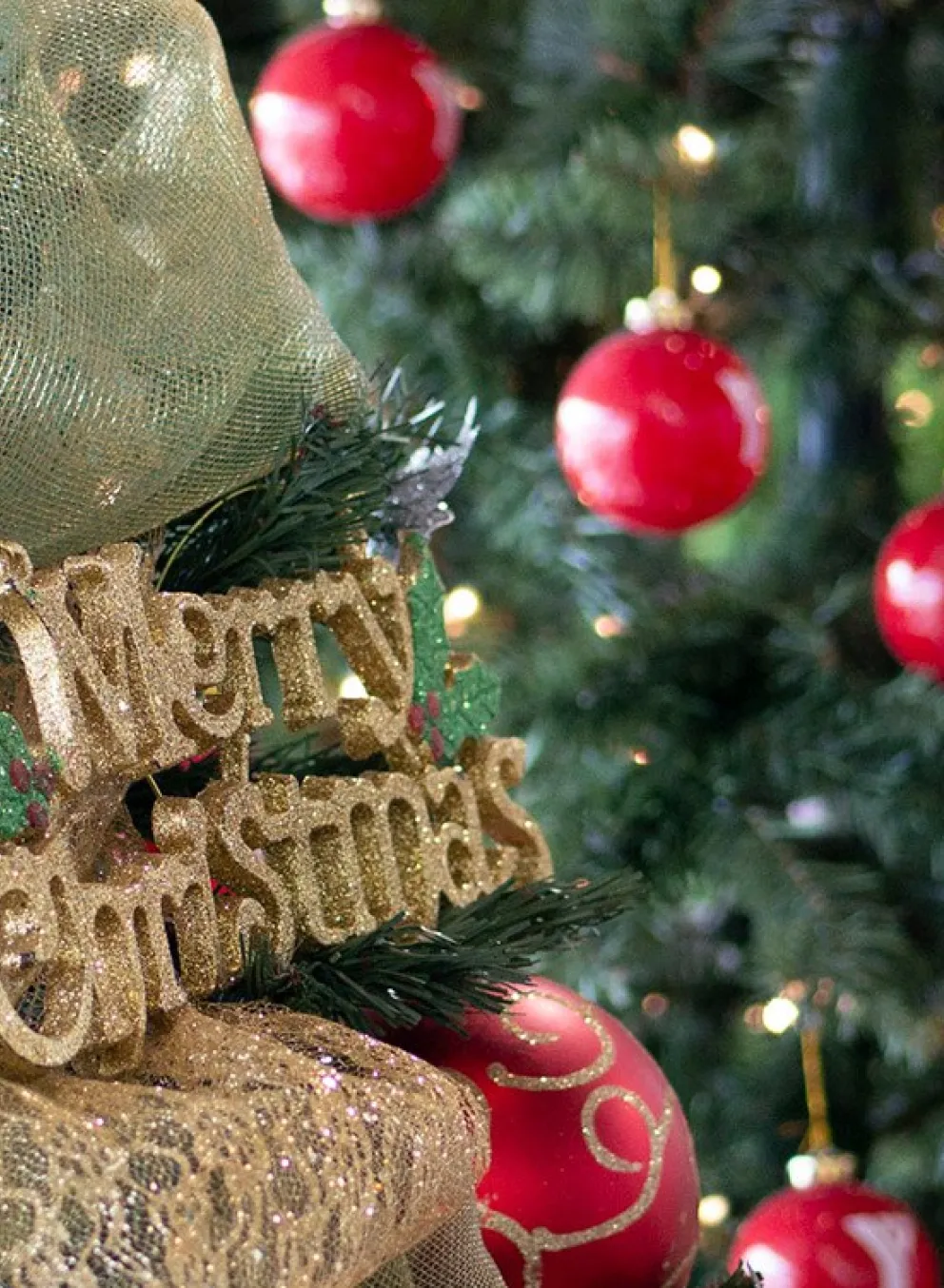 Christmas trees with gold Merry Christmas and red YMCA ornaments