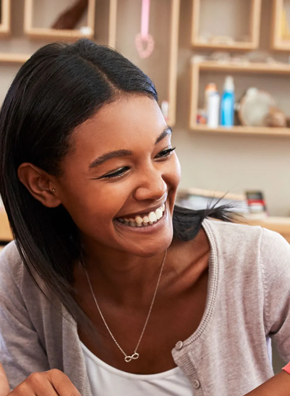 child care worker helping children with shape puzzle