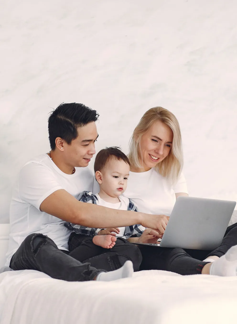 young family using a laptop