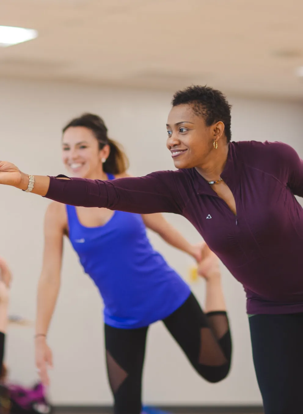 yoga class participants doing standing bow pose
