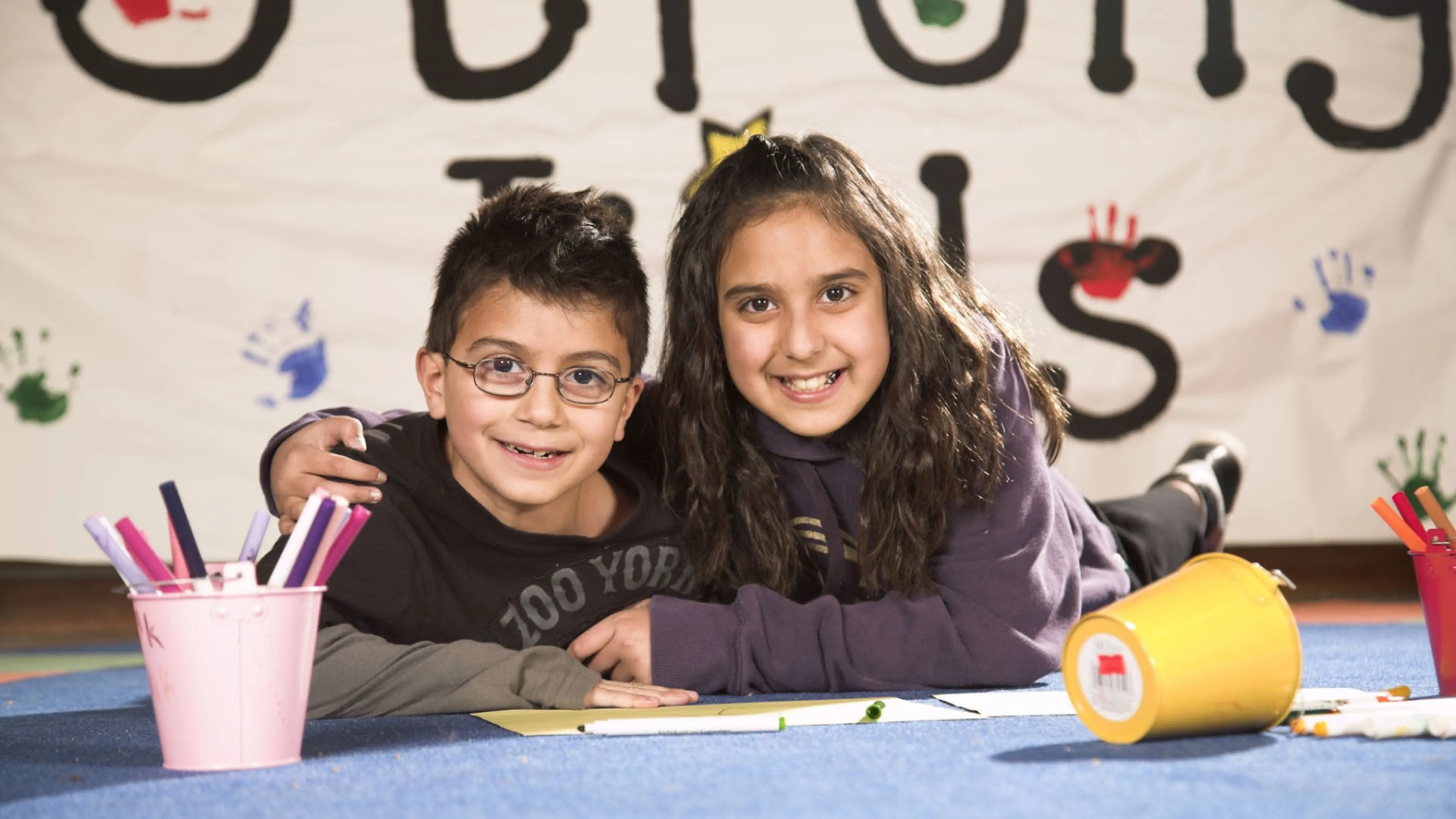 girl and boy hugging