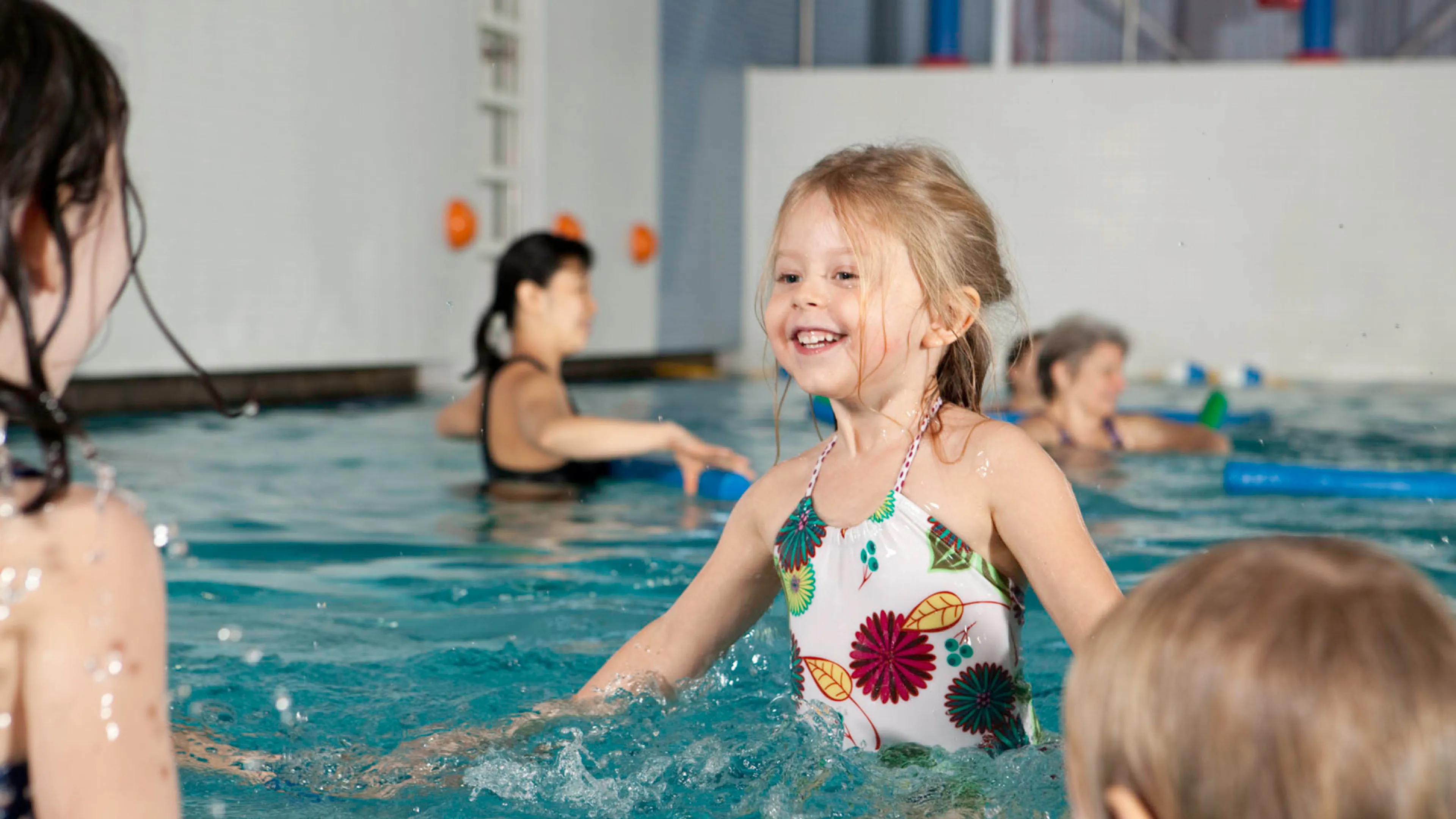 Young girl learning to swim