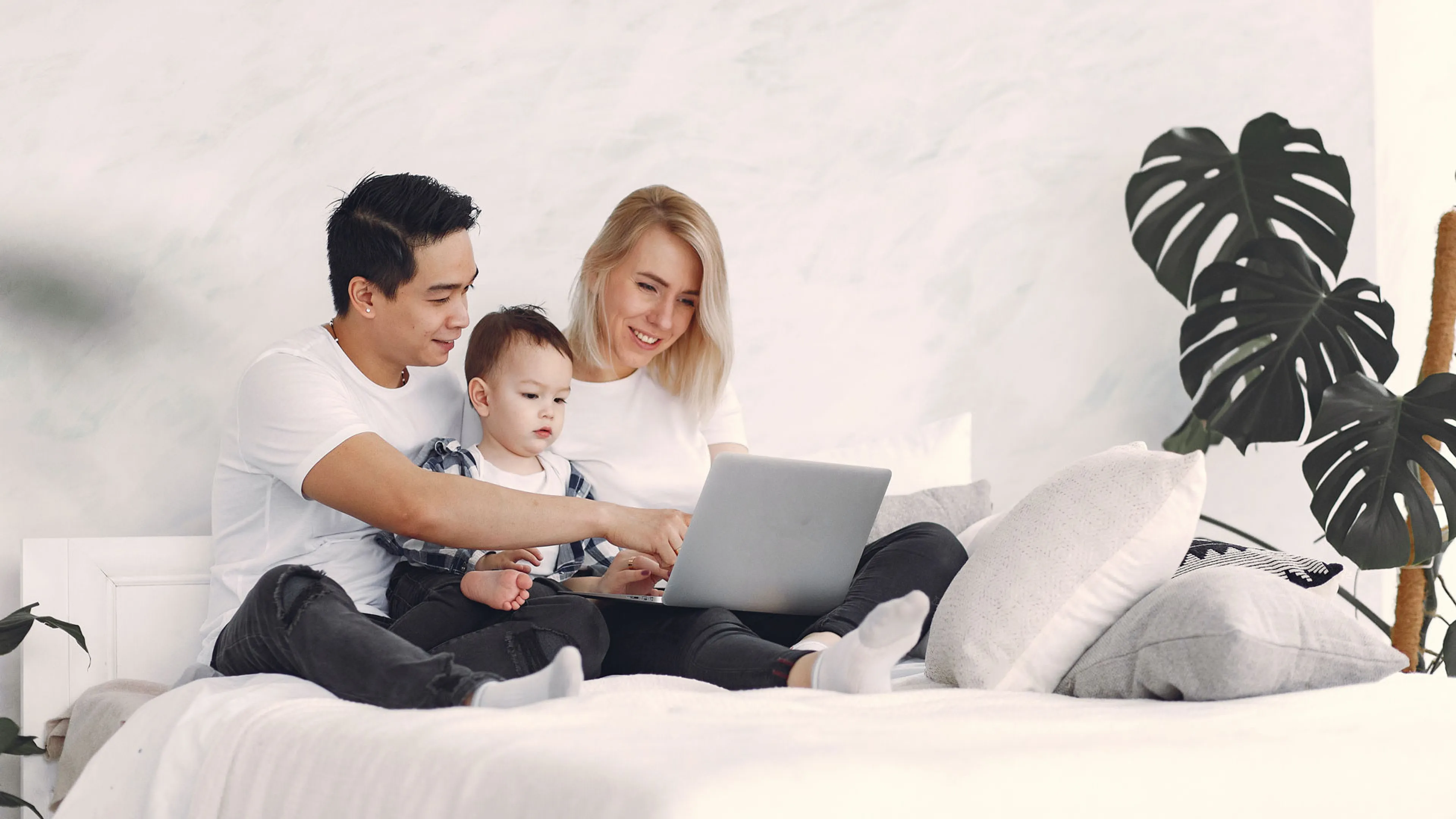 young family using a laptop
