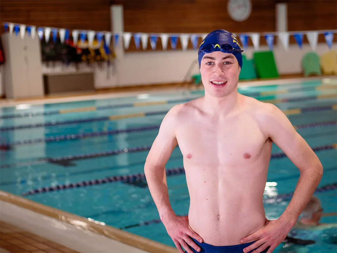 Zachary Bernier strikes a confident pose by the pool