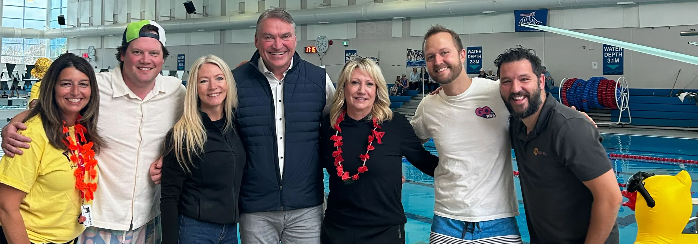 group of people standing in front of H2O pool at 2026 Make a Splash event