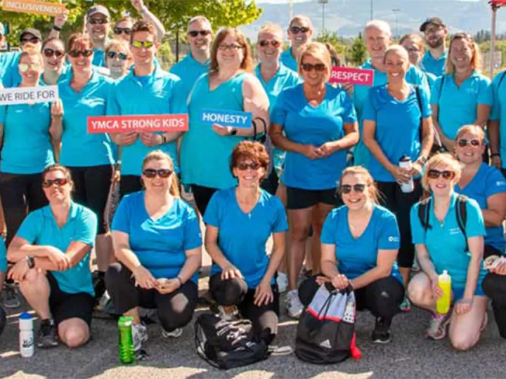 Team Interior Savings wearing blue and holding signs