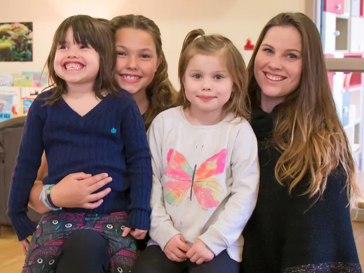 Ali and kids in child care room