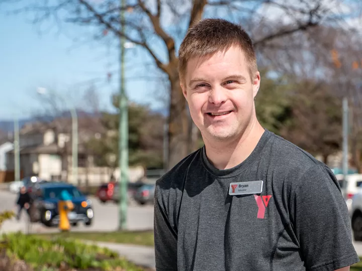 Bryan Smiling in front of the YMCA