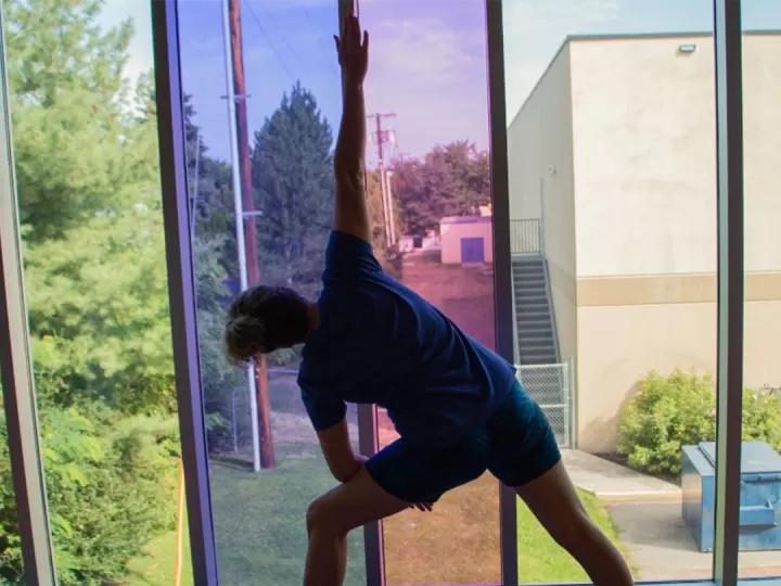 Kay doing a yoga pose