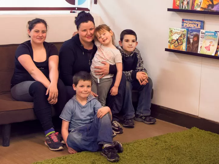 Dannie and kids in YMCA Beyond the Bell reading area