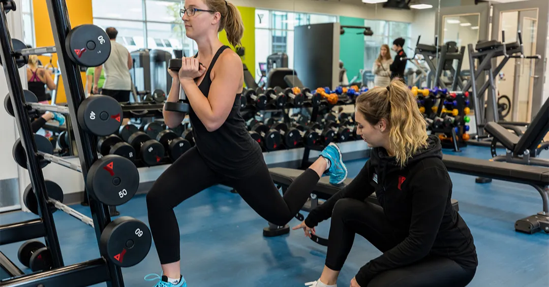 Fitness trainer coaching a member