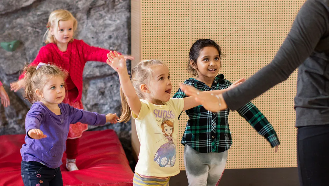 group of girls lifting their arms