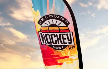 colourful HockeyFest Flag in front of sunlit clouds