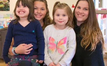 Ali and kids in child care room