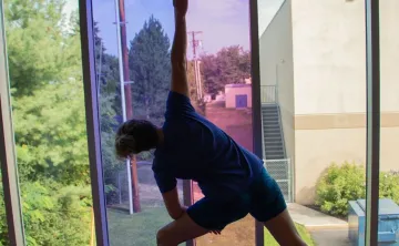 Kay doing a yoga pose