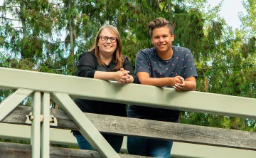 Val on a bridge with her son