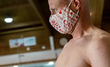 man at a pool with face mask