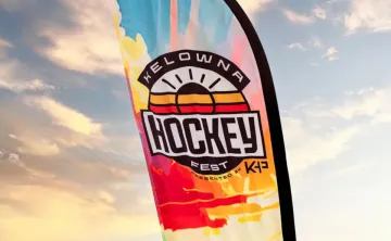 colourful HockeyFest Flag in front of sunlit clouds