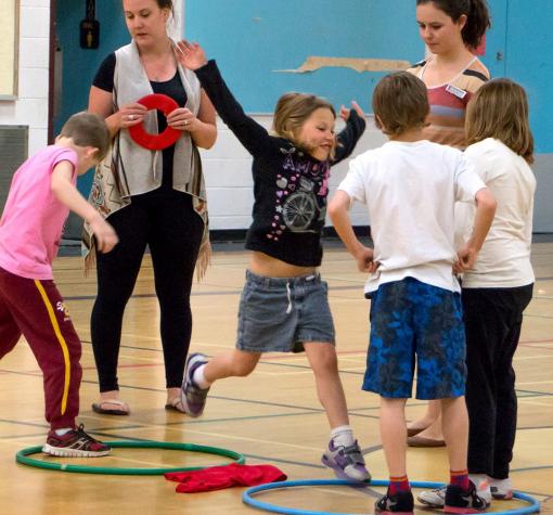 Beyond the Bell Hula Hoops 2015 (small banner mobile) kids playing game with hula hoops and rings