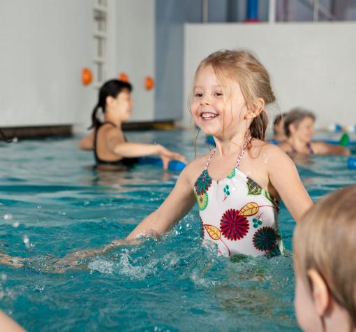 Swim lessons Young girl learning to swim