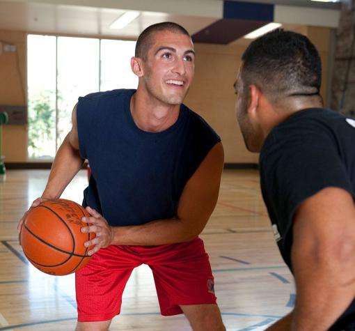 drop-in sports two young men playing basketball at the Kelowna Family Y
