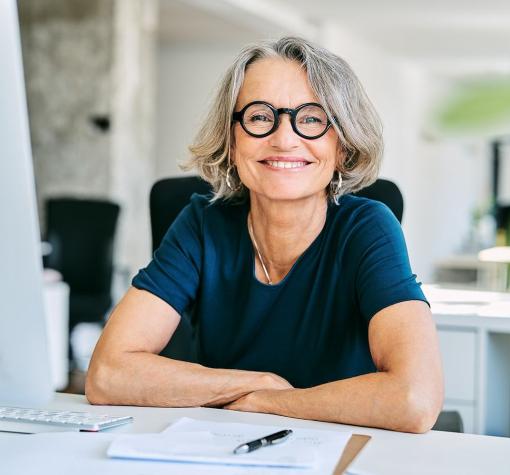 volunteer - smile woman smiling while sitting in front of computer