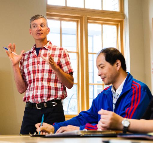 Men learning together in a classroom setting